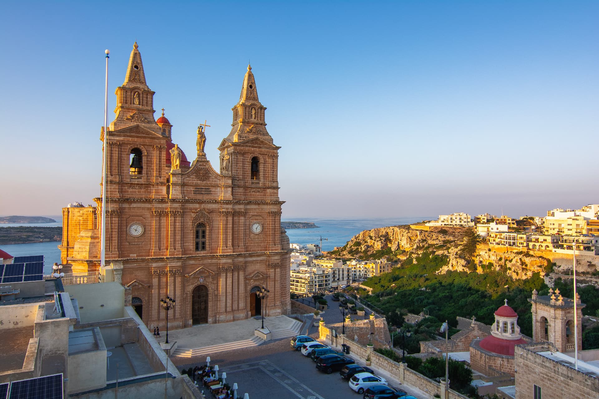 Mellieħa Parish Church and bay at sunset, near Scuba Life Malta's partner hotels